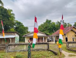 Satgas TMMD Kodim 0416/Bute dan Warga Tanjung Agung Gotong Royong Pasang Merah Putih Sambut Bulan Kemerdekaan